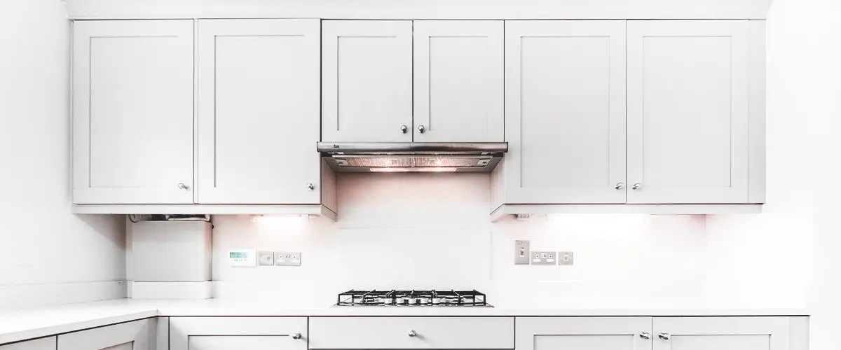 white kitchen with natural wood countertops white cabinets